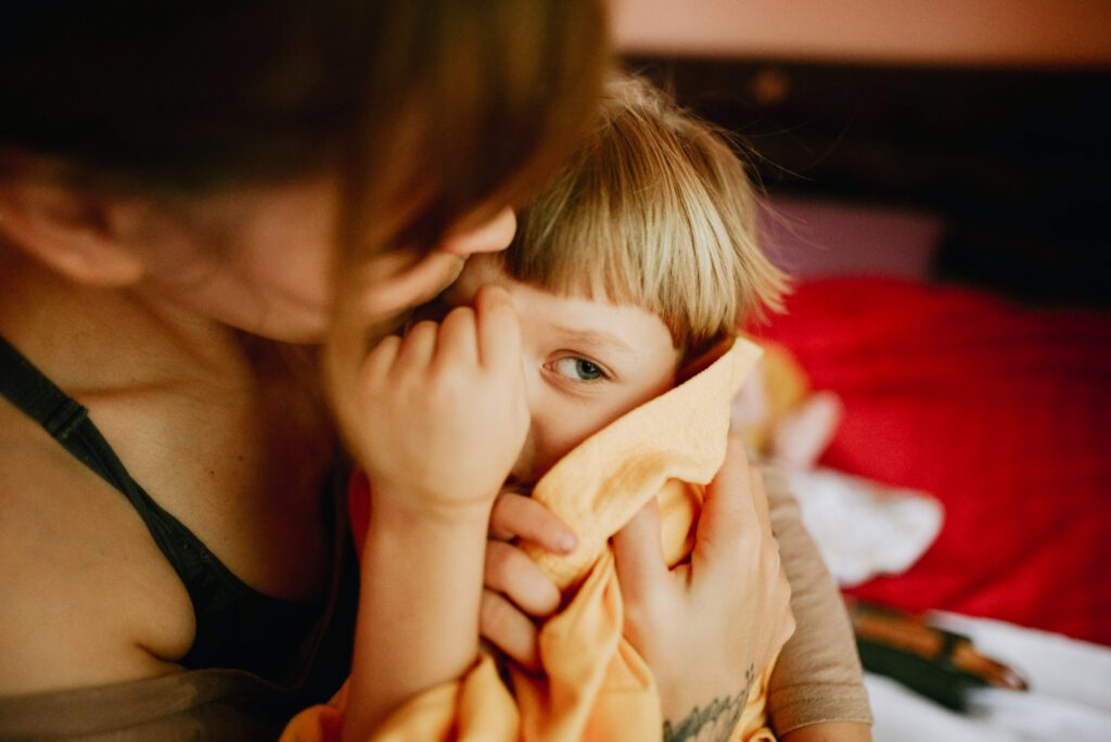 mother holding son in arms