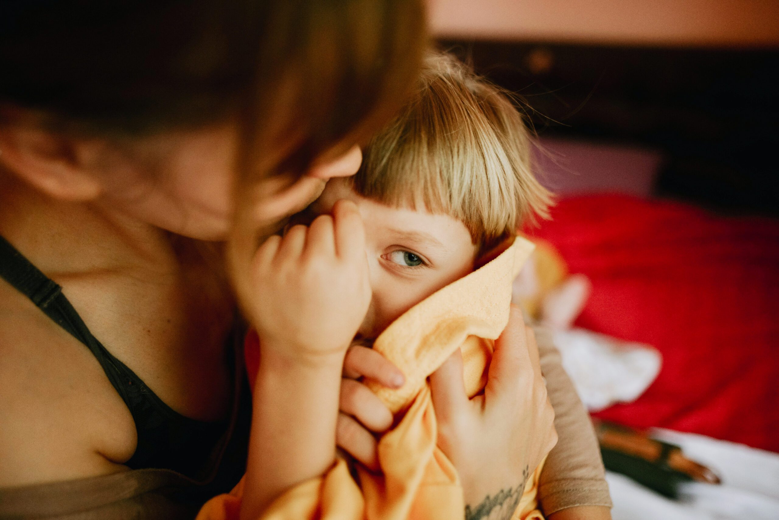mother holding son in arms
